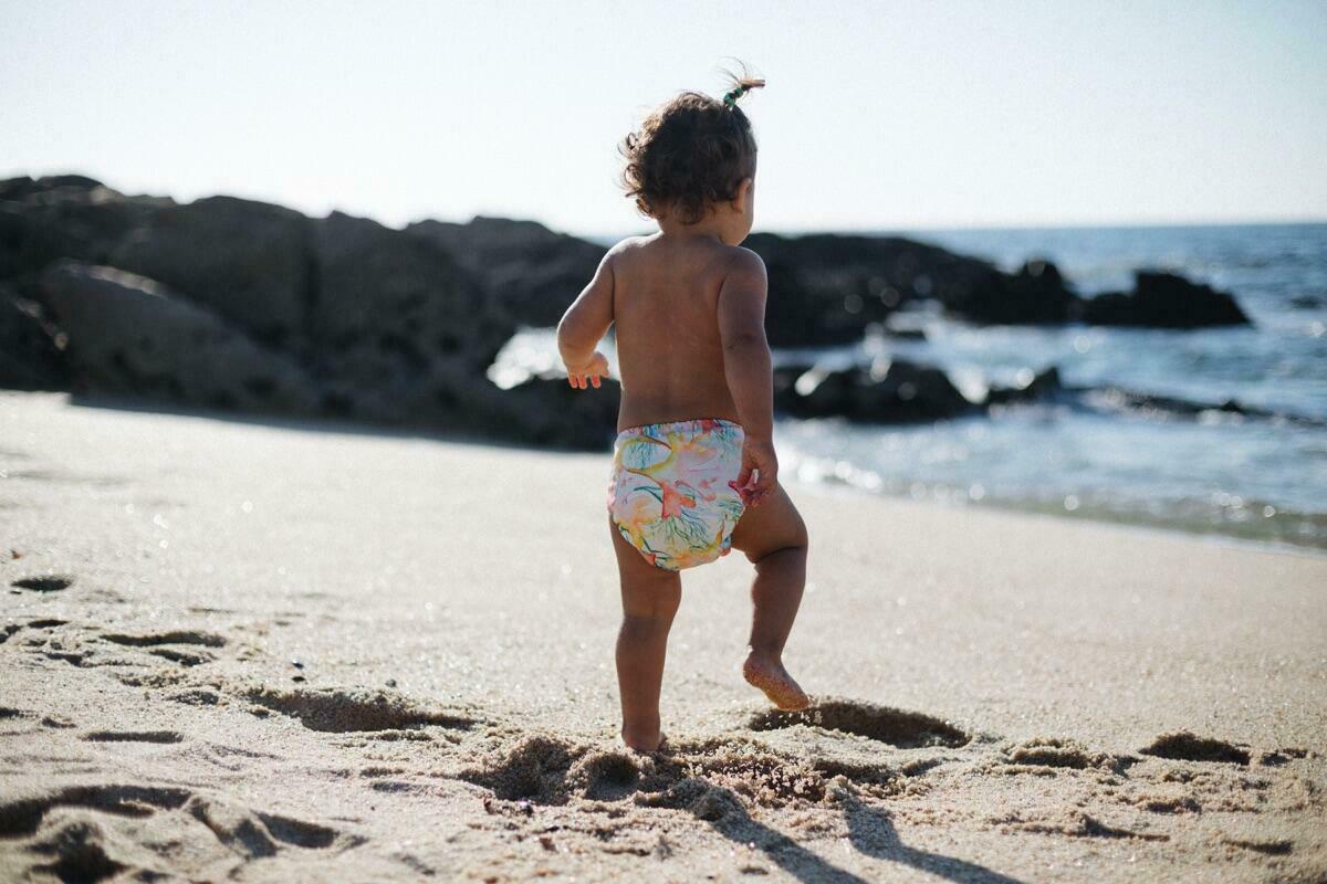 Toddler running on sand